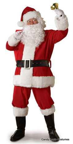 a man dressed as santa clause holding a bell in his right hand and giving the peace sign