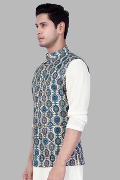 Introducing our stunning Bluish Blue and Claret Red Thread Embroidered Nehru Jacket, a perfect blend of tradition and contemporary style. Ideal for weddings, engagements, or parties, this jacket exudes charm and sophistication. Crafted with meticulous detail, the intricate thread embroidery adds a touch of elegance. Versatile as casual wear, pair it effortlessly with a Kurta Jacket set for a refined ensemble. Elevate your look with this classic Nehru Jacket, a must-have for any fashion-forward m Formal Traditional Kurta With Motifs, Fitted Blue Nehru Jacket For Designer Wear, Fitted Blue Nehru Jacket For Designer Events, Traditional Nehru Jacket With Pallu For Reception, Designer Wear Elegant Nehru Jacket For Festivals, Elegant Designer Nehru Jacket For Festivals, Elegant Nehru Jacket For Designer Wear And Festivals, Festive Nehru Jacket With Intricate Embroidery For Transitional Season, Elegant Nehru Jacket For Diwali Festive