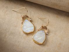 Our elemental Livi Earrings are crafted with a gold-edged moonstone and gilded satellite chain as a twinkling accent to complete the look. Handcrafted by LuLu Designs in Mill Valley, California, our exclusively curated jewelry collection showcases unique designs that combine organic textures and traditional elements, celebrating the natural beauty of hand-worked metals and stones. Mill Valley California, Organic Textures, Mill Valley, Unique Earrings, Twinkle Twinkle, Gold Vermeil, Moonstone, Natural Beauty, Jewelry Collection