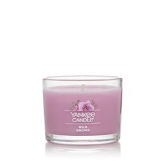 yankee candle with pink flowers on it