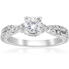 a white gold engagement ring with diamonds on it