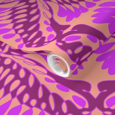 an abstract purple and pink background with circles on it's surface, including a circular hole in the center