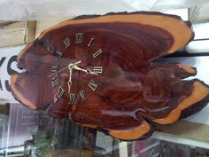 a clock made out of wood with roman numerals