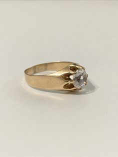 Charming antique 1900s Edwardian era 14k rosy yellow gold created sapphire ring! This pretty antique ring is set with a created sapphire gemstone that weighs approximately 1.28CT. Lovely piece of early 1900s era jewelry ERA - Circa early 1900s / Edwardian Era METAL / MATERIAL - 14k rosy yellow gold, created sapphire -approximately 1.28 cts MARKINGS / HISTORY - unreadable but tested SIZE / MEASUREMENTS - Size: 9, Back of shank:8mm, Ring Head Height: 6 mm, Weight: 3.80 grams, sapphire: 7 mm It may Mens Sapphire Ring, Saphir Ring, Retro Ring, Antique Ring, Hand Ring, Edwardian Era, Ruby Ring, Mens Wedding Rings, Sapphire Gemstone