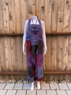 100%  Nepali cotton overalls!  The perfect pair of comfy, each to wear hippie overalls. Unisex  Has front, side, and back pockets.  Simple design, loose fit and lightweight.  Harem pant style. (Drop crotch / MC Hammer)  Arm lengths have 3 adjustable button sizes to shorten or length top.  Great summer staple piece for casual and boho feel. Colors are beautiful and vibrant  Easy to wear  Nice thickness to the overall and not see through Multiple Sizes  S/M and M/L  100% Cotton  Made in Nepal 🇳🇵 Bohemian Cotton Jumpsuits And Rompers With Relaxed Fit, Cotton Summer Overalls For Festivals, Cotton Overalls For Summer Festivals, Summer Festival Cotton Overalls, Bohemian Sleeveless Overalls With Pockets, Hippie Cotton Overalls For Summer, Cotton Overalls For Festivals, Cotton Overall Jumpsuit For Festival, Cotton Overall Jumpsuits And Rompers For Festival