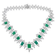 The diamonds, meticulously selected for their exceptional quality and brilliance, form a sparkling pave setting around the emerald. Each diamond is precisely cut to maximize its fire and radiance, adding a touch of glamour and elegance to the necklace. The diamonds delicately frame the emerald, accentuating its beauty and creating a captivating visual impact. Item Code :- CN-25487 (14k) Gross Wt. :- 59.64 gm 14k White Gold Wt. :- 51 gm Diamond Wt. :- 13.90 Ct. ( AVERAGE DIAMOND CLARITY SI1-SI2 & Diamond Emerald Necklace, Pave Diamond Earrings, Pave Diamond Band, 16 Inch Necklace, Diamonds Jewelry, Gold Jewelry Necklace, Necklace Diamond, Emerald Necklace, Necklace Size