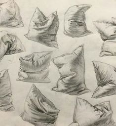 a pencil drawing of pillows on a piece of paper