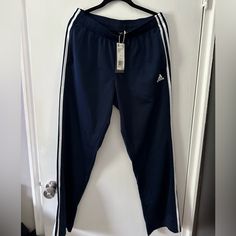 Brand New With Tags. Men’s Adidas Track Pants. Size L. Navy Blue Blue Adidas Streetwear Pants, Adidas Blue Streetwear Pants, Casual Navy Adidas Bottoms, Casual Navy Adidas Pants, Adidas Navy Cotton Bottoms, Casual Navy Pants With Three Stripes, Blue Adidas Sweatpants With Pockets, Adidas Blue Sweatpants With Pockets, Pans Adidas