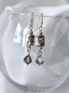 Jindo Lane's pretty little earrings are mostly simple crystals and beads, base metals and occasional gemstones. They are meant to be fun, light, and inexpensive, just perfect for gift giving! Hooks are hypo allergenic. Adjustable Metal Earrings With Faceted Beads, Metal Beaded Earrings With Faceted Beads For Gifts, Silver Czech Glass Earrings As Gift, Silver Czech Glass Earrings For Gift, Crystal Earrings With Faceted Beads As Gift, Silver Beaded Drop Earrings As Gift, Silver Beaded Drop Earrings For Gift, Adjustable Silver Crystal Earrings As Gift, Adjustable Nickel-free Silver Crystal Earrings