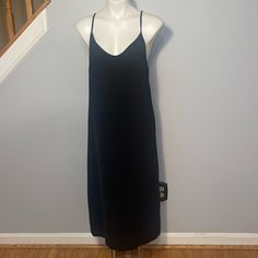 See You Monday Ladies Large Black Slip Midi Dress. Slits On Both Sides. 100% Polyester. Pull On Style. Pit To Pit 18 Inches Shoulder To Hemline 46 Inches Black V-neck Midi Dress With Side Slits, Solid Color Spring Dress With Split Hem, Black Midi Dress With Split Hem For Spring, Sleeveless Slip Dress With Side Slits For Date Night, Knee-length Maxi Dress With Side Slits For Date Night, Elegant Black Midi Dress With Split Hem, Black Maxi Dress With Split Hem For Spring, Black Long Dresses With Side Slits, Black Midi Dress With Split Hem For Night Out