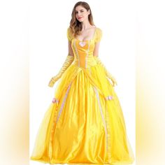 a woman in a yellow dress is posing for the camera