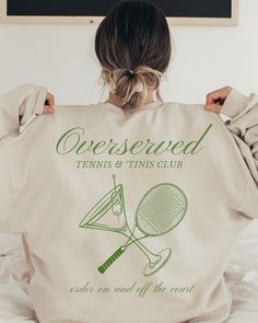 "The perfect chance to wear a Tennis and 'Tinis Overserved Sweatshirt. This makes a great way to have soft cozy oversized clean girl aesthetic travel sweatshirt. Perfect gift for a birthday, bachelorette party or celebration! Gildan 18000 Sweatshirt  Unisex Adult Sizing  Listing includes: Sweatshirt Only  50% Cotton, 50% Polyester Made To Order:  This is a Direct-To-Garment item and the ink is printed into the fabric, which prevents cracking and peeling.  Size:  Photos include size charts with d Tennis Academy, Travel Sweatshirt, Tennis Party, Tennis Shirt, Clean Girl Aesthetic, Photoshoot Idea, Club Sweatshirts, Tennis Shirts, Bridesmaid Proposal Gifts