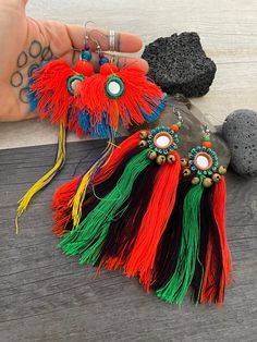 Unique long fun and colorful tassel earrings, made in a beautiful shape with small mirror beads in the middle, but eat pair has its unique look. Both will rock your everyday outfit and are super light what makes them easy to wear. A unique addition to your jewelry collection. The pair #1 is 15cm- 6inch long 7.5cm- 3inch wide. It has a drop length of 15.8cm- 6.25 inch The pair #2 is 11.2cm- 4.5 inch long 5.5cm- 2.25 inch wide It has a drop length of 13.2cm- 5.25 inch ⚡️Join Akashi's VIP list for Multicolor Tassel Earrings For Gifts, Unique Multicolor Tassel Earrings For Gift, Colorful Dangle Tassel Earrings Gift, Colorful Tassel Earrings As A Gift, Colorful Tassel Earrings For Festivals, Tassel Earrings As A Gift, Colorful Tassel Earrings For Gift, Colorful Tassel Jewelry As A Gift, Colorful Tasseled Jewelry For Gifts