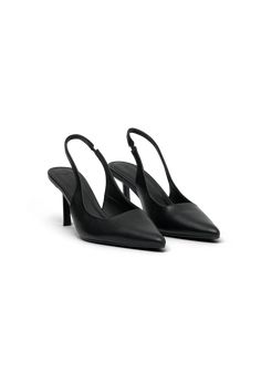 Slinging sexy back. DASHA is a pair of two-inch heels with elasticated back straps and pointed toes. Minimalist and elegant, these faux leather shoes are perfect for desk-to-dinner affairs. The pointed toe design creates an elongated silhouette that pairs well with flared pants and fitted skirts. The elasticated back straps and fairly low heel leads to a comfortable fit that’s ideal for all-day wear. If you need an ‘everything’ shoe, Dasha is the perfect accessory. Pointed Toe Slingback Pumps With 4-inch Heel For Work, Sleek Slingback Sandals With Wrapped Heel, Slingback Pumps With Wrapped Heel For Night Out, Sleek Slingback Kitten Heels For Office, Business Slingback Pumps With 4-inch Heel, Sleek Slingback Kitten Heels With Padded Heel, Sleek Slingback Pumps With Padded Heel For Night Out, Sleek Ankle Strap Slingback Pumps For Work, Sleek Ankle Strap Slingback Pumps For Business