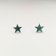 These marbled green star stud earrings add a touch of cuteness and simplicity to any outfit. Perfect for those who don't take themselves too seriously and want to add some fun to their accessory game. (Not just for stars, but for starlets, too!) 🌟 All orders are packaged with care. Each box includes tissue paper, a tealight and a KelZo postcard. Product details: Polymer clay Approx 0.8cm Hypoallergenic stainless steel studs ****Colours may vary slightly from image due to resolution differences. Colour patterns may not match photographed item but will be cut from same piece/collection. Shapes and sizes may also vary due to the nature of handmade products.*** Care and Returns Please handle your KelZo Jewellery with care, as it is handmade and more fragile compared to mass market jewellery. Green Star Earrings For Pierced Ears, Star Stud Earrings, Green Star, Moon Collection, Star Earrings Stud, Mass Market, Star Studs, Gift Vouchers, Tealight