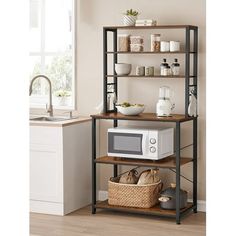 a microwave oven sitting on top of a wooden shelf