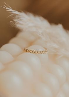 We love this chain ring worn individually for a simple adornment, or stacked for a stronger statement. 1.8mm band width. Available in 14kt Gold Fill. Due to the making process, this ring may run +/- 1/4 size. Paired on Jess with our Confetti Rings and Valley Trio. Handmade in Eau Claire, WI. Our jewelry is handmade so each piece will be unique and may vary slightly from what is pictured. 14k Gold Thick Band For Promise, Minimalist Tarnish-resistant Stackable Promise Rings, Delicate 14k Gold Curb Chain Jewelry, Minimalist Stackable Jewelry With Thick Band, Tiny 14k Gold Toe Ring, Minimalist Thick Band Stackable Jewelry, Everyday 14k Yellow Gold Eternity Band, Minimalist Stackable Thick Band Jewelry, 14k Gold Dainty Curb Chain Jewelry