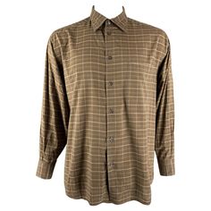 ERMENEGILDO ZEGNA long sleeve shirt comes in brown plaid cotton featuring a patch pocket at left side, straight collar, one button round cuff, and a button up closure. Made in Italy.Excellent Pre-Owned Condition. Marked: XL Measurements: Shoulder: 22 inches Chest: 54 inches Sleeve: 26 inches Length: 32 inches Reference: 112221 Category: Long Sleeve Shirt More Details Brand: ERMENEGILDO ZEGNA Size: XL Color: Brown Pattern: Plaid Fabric: Cotton Style: Button Down Age Group: Adult Gender: Male Classic Long Sleeve Flannel Shirt For Business Casual, Formal Plaid Shirt For Fall, Casual Long Sleeve Flannel Shirt For Business, Brown Shirt With Welt Pockets And Spread Collar, Classic Brown Flannel Shirt With Button Closure, Classic Long Sleeve Flannel Shirt With Welt Pockets, Classic Brown Button-up Flannel Shirt, Collared Brown Shirt With Welt Pockets, Brown Collared Shirt With Welt Pockets