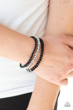 A collection of faceted black and silver beads are threaded along stretchy bands around the wrist. White rhinestone encrusted rings are added to one strand for a refined finish. Sold as one set of three bracelets. P9RE-BKXX-242XX Trendy Fringe, Silver Bead Bracelet, Ball Necklace, Black Bracelets, Paparazzi Accessories, Stretchy Bracelets, Bead Bracelets, White Rhinestone, Silver Bead