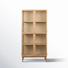 a wooden bookcase with four shelves on one side and two doors on the other