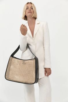 A throwback to St. Agni’s signature woven rattan style, the Rattan Basket Tote combines traditional techniques with a contemporary approach. Featuring a leather strap, side and base and a natural rattan front and back panel. The Rattan Basket Tote is ideal for carrying all your essentials and more. Rattan Style, St Agni, Leather Factory, Byron Bay Australia, Basket Tote, Woven Rattan, Rattan Basket, Sheep Leather, Basket Bag