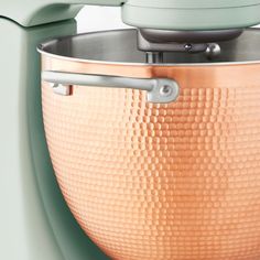 a large metal pot with a handle on it's side and the lid closed