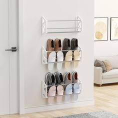 a wall mounted shoe rack holds several pairs of shoes