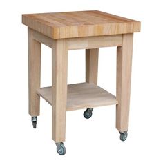 a small wooden table with wheels on the bottom and one drawer open to reveal a cutting board