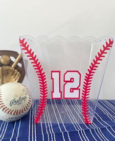 two baseballs and a glove on a table