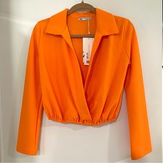 New With Tags, Never Worn, Excellent Condition Size Small Fabulously Bright Orange In Color Lapel Collar Crossover Neckline Long Sleeves Elastic Cuffs Top Hits At Waistline Orange V-neck Blouse For Party, Cuffed Top, Top Hits, Flowy Top, Flowy Tops, Lapel Collar, Bright Orange, Zara Tops, Crossover