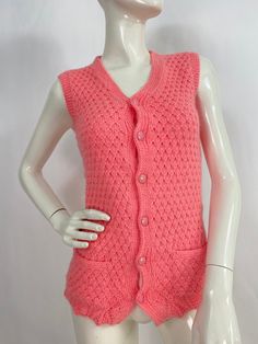 "70s knit vest, 1970s pink vest, hand knit vest, fits like a small/xsmall Measurements:  Shoulder (outer seam-seam)14\"/bust(armpit-armpit)16\"/waist/width 15\"/length 24\" Mannequin measurements:  5'8\", bust 34\", waist 25\", hip 33\" Please note that vintage clothing sizes can vary greatly.  The Measurements provided  are approximate and are taken lying flat.  I suggest taking a similar garment from your wardrobe and measure it while lying flat.  This way you can compare measurements.  All of our pieces are genuine vintage. Don't forget to enlarge the photos and take a closer look at this genuine vintage item!! I will ship your item off within 1-2 business days. I ship expedited for all Canadian and US orders. All other destinations world wide will be shipped surface and therefore may t Pink Knitted Sweater Vest For Winter, Fitted Pink Sweater Vest, Casual Style, Fitted Pink Casual Sweater Vest, Casual Fitted Pink Sweater Vest, Pink Fitted Casual Sweater Vest, Pink Fitted V-neck Sweater Vest, Pink Fitted Vest For Winter, Pink Knitted Sweater Vest For Spring, Fitted Sleeveless Pink Sweater Vest