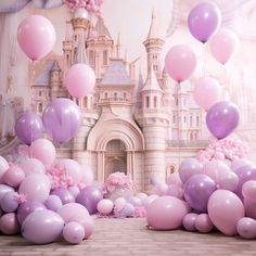 there are many pink and purple balloons in front of a castle with princess's castle on it