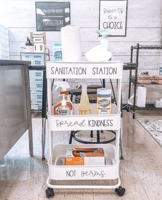 a white cart filled with lots of different types of items on top of a tiled floor