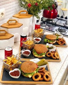 three trays filled with food sitting on top of a counter