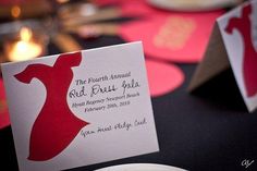 a close up of a table with plates and napkins on it's place cards