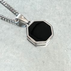 Black Enamel Octagon Face Pendant High Grade Stainless Steel Pendant dimension: 0.75" diameter 24" Chain Link Necklace Complimentary Storage Pouch Black Metal Pendant Chain Necklace, Black Stainless Steel Chain Necklace, Elegant Black Curb Chain Necklace, Black Metal Jewelry With Box Chain, Elegant Black Curb Chain Jewelry, Black Metal Box Chain Necklaces, Black Metal Necklace With Box Chain, Black Stainless Steel Jewelry With Black Enamel, Black Stainless Steel Medallion Necklaces