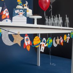 a birthday cake and party decorations on a table