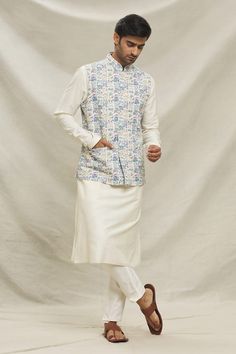 Multi color bundi with floral pattern. Paired with an inner cream kurta and pyjama. - Aza Fashions Designer Cream Sets With Printed Motifs, Designer Cream Kurta With Printed Motifs, Cream Chanderi Kurta With Printed Motifs, Off White Straight Kurta With Printed Motifs, Festive Off White Kurta For Spring, Festive Off White Sets With Floral Print, Festive Off White Floral Print Sets, Festive Off-white Floral Print Sets, Designer Cotton Silk Kurta With Kalamkari Print