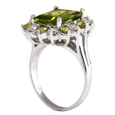 Stamped: 14K White GoldTotal Ring Weight: 6.5 GramsRing Length: N/ARing Width: N/AGemstone Weight: Total Natural Peridot Weight is 4.27 Carat (Measures: 11.06x8.87mm)Color: GreenDiamond Weight: Total Natural Diamond Weight is 0.70 CaratColor: F-G, Clarity: VS2-SI1Face Measures: 18.42x16.83 mmSku: [702688W] Luxury Multi-stone Peridot Ring, Luxury Peridot Multi-stone Rings, Formal Peridot Diamond Ring In Yellow Gold, Peridot Multi-stone Rings For May Birthstone, Elegant Peridot Birthstone Ring With Prong Setting, Luxury Peridot Ring For Formal Occasions, Emerald Cut Peridot Jewelry For Formal Occasions, Emerald Cut Peridot Jewelry For Formal Events, Elegant Peridot Diamond Ring