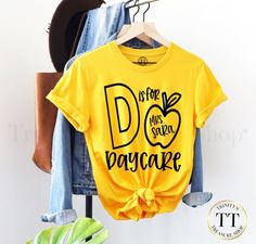 Check out this item in my Etsy shop https://www.etsy.com/listing/1059060333/personalized-daycare-shirt-daycare First Day Of School Gift From Teacher To Student, Teacher Of All Things Shirt, T Shirt For Teachers, Back To School Art Projects For Infants, Back To School Gifts For Preschoolers, Kindergarten Tshirt Ideas Teacher Shirts, Vinyl Teacher Shirts, Teacher Fall Shirts, First Day Of School Shirt Teacher