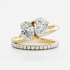 two pieces of gold and diamond engagement rings