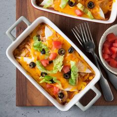 two casserole dishes filled with mexican food