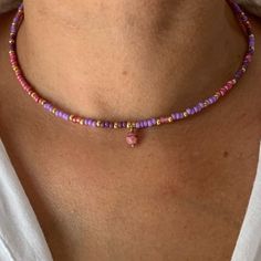 "This purple mauve seed bead necklace is so charming !    The fashion favorite colors right now ! Colors ? Yes ! It's your little extra \"Je ne sais quoi\"  Wear your necklace on its own, in a seek style or as a bohemian accumulation * Materials:  14K GOLD FILLED high quality clasp and extension chain. Gold-filled is a thick layer of gold on metal, a higher-quality material than gold-plated. Pendant : Faceted glass bead diam 6mm Best quality glass seed beads. * Size: The necklace is a choker that measures 39 cm + an extension chain of 3 cm.  * Customization If you want a different length or a particular color, write me a message. I will be happy to make your unique design !   * Delivery The parcel is shipped within 1 to 2 days by 📩 TRACKED PARCEL SERVICE 📩 Your jewelry comes in a pretty Purple Seed Beads Necklace, Purple Beaded Jewelry, Purple Bead Necklace, Layered Beaded Necklaces, Purple Mauve, Diy Jewelry Unique, Necklace Bead, Seed Bead Patterns, Necklace Purple