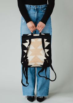 Black, cream and tan Aztec inspired backpack Clasp closure on the front Adjustable straps and handle Measures 14" x 11.5" x 4.5" 100% Cotton Lining: 100% Polyester Beige Backpack For On-the-go, Beige Rectangular Leather Backpack For On-the-go, Trendy Cream Standard Backpack, Trendy Cream Backpack, Trendy Backpack With Leather Handles For On-the-go, On-the-go Backpack With Top Carry Handle, Beige Rectangular Bag With Adjustable Straps, Beige Rectangular Bags With Adjustable Straps, Beige Tote Bag With Adjustable Straps