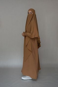 Avalom prayer gown umrah abaya dress non-wrinkling in brown - ANNAH HARIRI Solid Long Thobe For Eid, Long Thobe For Eid, Modest Solid Color Floor-length Abaya, Modest Floor-length Abaya, Long Solid Niqab For Eid, Solid Long Niqab For Eid, Long Solid Color Hijab For Eid, Brown Long Dress For Eid, Long Brown Dress For Eid