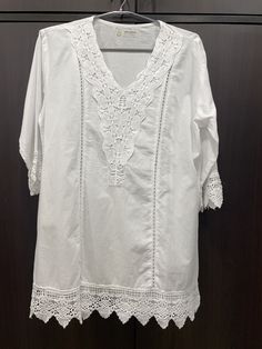 Introducing the perfect attire for you or a gift for your sister, daughter or your mom, a stunning pure cotton tunic that combines style, comfort, and exquisite design. Crafted with utmost care and attention to detail, this tunic showcases the timeless artistry of chikankari embroidery, adding a touch of elegance to its overall appeal. Made from high-quality pure cotton fabric, this tunic ensures exceptional comfort, allowing  a relaxed and effortless style. The soft and breathable material gent Spring Cotton Lace Top With V-neck, White V-neck Blouse With Chikankari Embroidery, Elegant Cotton Kaftan For Spring, Elegant Summer Cotton Kaftan, Cotton Tunic With Relaxed Fit For Daywear, Relaxed Fit Cotton Tunic For Daywear, Spring Cotton Kurta With Short Sleeves, Elegant Summer Cotton Tunic, Cotton Kurta With 3/4 Sleeves For Spring