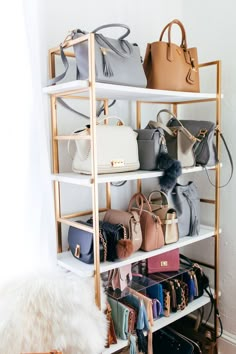 a white shelf filled with lots of purses and handbags on top of it