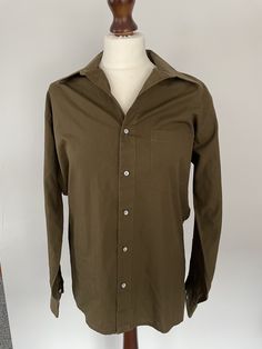 Marked a men's size 15. Lovely medium weight dark olive green cotton.  Chest: 44", 112cm Shoulder to hem: 25", 64cm Sleeve: 23", 59cm Vintage Green Buttoned Shirt, Green Military Style Button-up Shirt, Vintage Green Shirt With Button Closure, Military Button-up Shirt, 1970s Button-up Top With Buttons, John Henry, Dark Olive Green, Mens Oxfords, Green Cotton