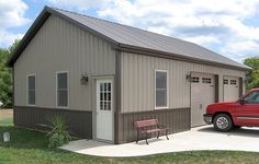 a red truck is parked in front of a metal building with two doors and windows