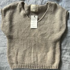 Nwt. No Size But Fits A Small Everyday Beige Knit Sweater Vest, Beige Knit Sweater Vest For Everyday, Cozy Beige Knitted Tops, Beige Knitted Tops With Relaxed Fit, Casual Oatmeal Tops For Winter, Casual Beige Sweater Vest For Everyday, Cozy Cotton Sweater In Neutral Color, Casual Beige Textured Knit Sweater Vest, Cozy Neutral Cotton Sweater